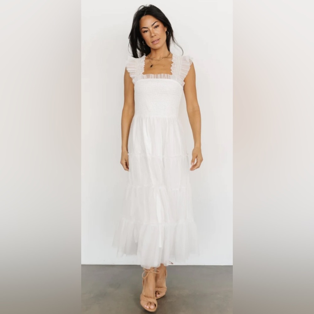 White tulle dress with fun shoulder frill details.